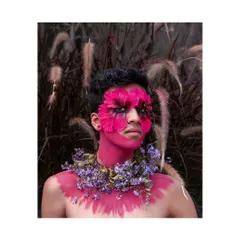 A high-fashion, editorial portrait where nature and makeup art collide. The floral elements and bold colors create a surreal and beautiful image.