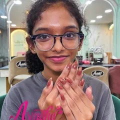 A happy client, who is also one of our students, showing off her beautiful brown nail extensions. We love seeing our students embrace their new skills.