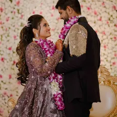 The garland exchange is a key moment in receptions and engagements. I capture the look of love and happiness the couple shares during this tradition.
