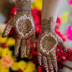 A beautiful and perfectly symmetrical mandala design, featuring a floral shape with negative space that makes the pattern pop.