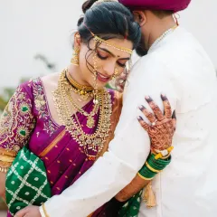 A quiet moment of togetherness for the bride and groom. I focus on capturing the deep connection and emotion in traditional Maharashtrian wedding attire, creating a timeless portrait.