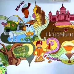 The left side of the Bengaluru mural, featuring Cubbon Park, an auto-rickshaw, and of course, dosa! It brings a lot of local flavor and color to the cafe.