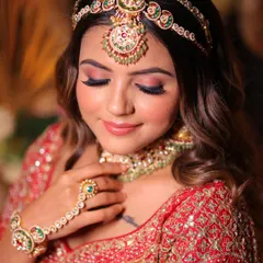 A close-up on the soft, rosy eye makeup and flawless skin. This is the kind of detail and precision we teach, ensuring every element of the makeup is perfect.