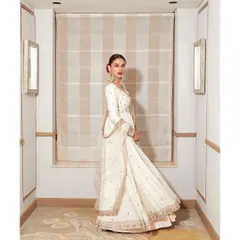 The full, flowing silhouette of the Jigar Mali anarkali. It's a look that commands attention with its grace and poise.