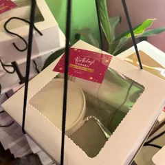 A close-up of a personalized birthday box. I add custom tags to make the recipient feel extra special.