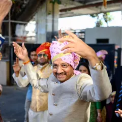 Even the parents get in on the baraat action. The father of the groom is all smiles as he dances his heart out.