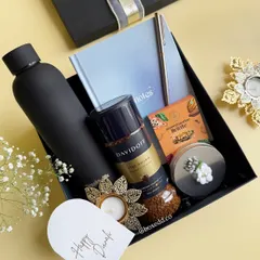 A glimpse into our luxury festive collection. This sleek black hamper for Diwali features premium Davidoff coffee, a matte black bottle, and elegant stationery, showing how we blend tradition with modern sophistication for corporate gifting.