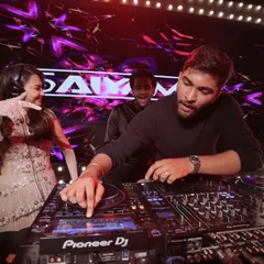 For me, DJing isn't just about playing music; it's about connecting with everyone. Here I am showing the bride the ropes at her own wedding party. It’s these interactive moments that make a celebration unforgettable.