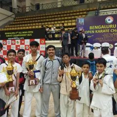 I am incredibly proud to stand with my team of young champions at the Bengaluru 2nd All India Open Karate Championship. Their hard work and dedication are reflected in the numerous trophies and medals they have earned.