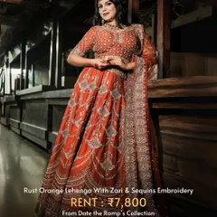 A rust orange lehenga with intricate zari and sequin embroidery. This is a perfect outfit for a Karwa Chauth or Diwali party.