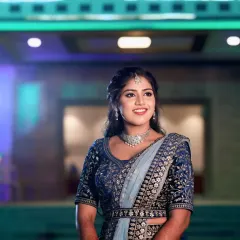 For Sneha's reception, we went for a soft glam look to match her elegant blue lehenga. The focus was on luminous skin and a subtle smokey eye, creating a polished and modern bridal style that lasted all night.