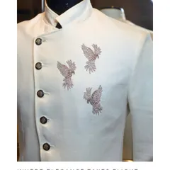 This off-white bandhgala jacket showcases our 'Elegance Takes Flight' motif. The three soaring birds are hand-embellished with silver sequins, creating a subtle yet striking effect.