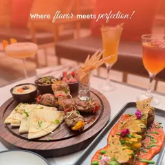 Where flavour meets perfection. A spread of our Lebanese platter and other beautifully plated appetizers, ready to be enjoyed with refreshing drinks.