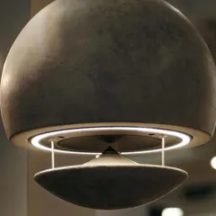 A close-up of the Spherina Air Pluma, showcasing its unique design and material composition. The integrated ring light adds another layer of functionality, making it both a high-performance speaker and an ambient light source. It is a true fusion of sound and design.