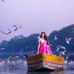 We created this simple, old-school saree look for a shoot at Yamuna Ghat. The goal was to capture a timeless and serene moment, blending the elegance of a classic pink saree with a stunning natural backdrop.