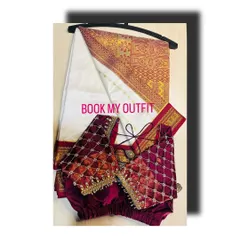 This set pairs a classic off-white and red silk saree with a custom-stitched maroon velvet blouse. The blouse's quilted beadwork adds a rich texture that beautifully complements the traditional weave of the saree.