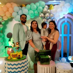 A happy family photo with the birthday boy, Kanishk, in front of his cake and beautiful decorations. I love being there to capture these precious moments.