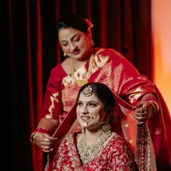 A tender, candid moment between a bride and her mother. We focus on capturing these priceless emotional connections that tell the real story of your wedding day.