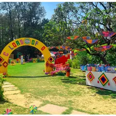 The entrance to the 'Colors of EO' Holi party featured a bright yellow archway, setting a joyful and welcoming tone for the celebration.