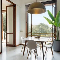 Our office is designed to connect with its surroundings. The dining area opens onto a balcony overlooking the trees, providing a space for our team to pause, connect, and draw inspiration from the natural light and energy of the city.