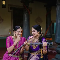 A playful moment during a Sankranti shoot, with the women enjoying sugarcane, a key element of the harvest festival.