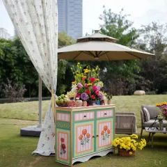 We believe every corner should be a photo opportunity. This hand-painted cabinet, overflowing with fresh flowers and fruit, served as a beautiful and functional decor piece for the outdoor celebration.