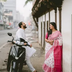 Laughter on a city street. This candid moment with a scooter adds a touch of modern life and fun to Chaitrali and Parth's pre-wedding shoot in the old city of Pune.