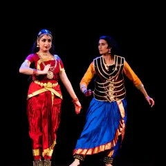 A scene from "The Wheel of Choices," where I am in character as Karna. The costuming and interactive pose with another dancer highlight my experience in ensemble productions and character portrayal.