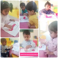 A collage of our playgroup children deeply engaged in their sponge painting activity. This simple craft helps develop their pincer grip and artistic expression.