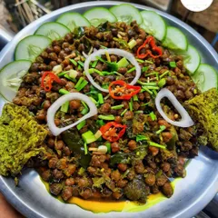My 'Kelichana paknam machet', a spicy chickpea snack served with savory cakes. It's a traditional and very popular evening snack in Manipur.