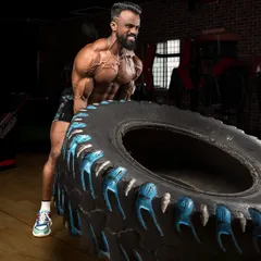 Functional strength is key. Flipping this heavy tire builds raw power and conditioning that you can't get from machines alone. This is what I mean by intense training.