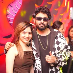Posing with a fan during my set. I love connecting with the people who enjoy my music.