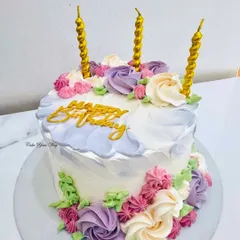 Blooming with sweetness because birthdays deserve flowers and cake. This design features a watercolor buttercream effect and beautiful piped rosettes.