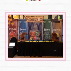 The Sorting Hat station, where guests can be sorted into one of the four Hogwarts houses: Gryffindor, Ravenclaw, Hufflepuff, or Slytherin.
