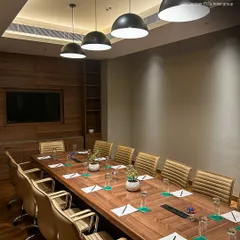 The sleek design of my boardroom is evident from this angle, showing the seamless integration of technology and comfort. It is an ideal space for hosting clients or conducting internal team workshops that require a polished environment.