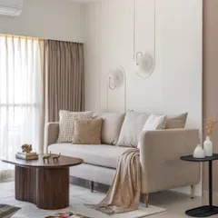 This living room, featured in Livingetc, showcases my clean, modern aesthetic. The design uses a neutral sofa, unique wall sconces, and a sculptural coffee table to create a look of effortless, understated luxury.