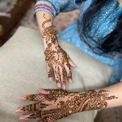 A view of two different Arabic-style designs, one a floral vine and the other a fuller pattern.