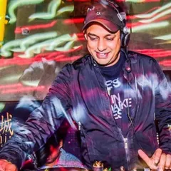 In the zone at the DJ console, feeling the energy of the room. This is where I am most at home, mixing tracks and interacting with the crowd to create a dynamic and responsive live music experience.