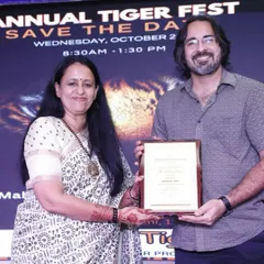 Receiving a certificate of appreciation for my participation in the school's Annual Tiger Fest. It is always an honor to be recognized for contributing to community and educational events through my art.