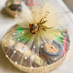 A bespoke luxury hamper created for Huawei, beautifully wrapped in gold tulle. These hampers are perfect for high-end corporate gifting and can be fully customized.