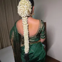 Another beautiful example of a South Indian bridal hairstyle, with a long braid completely covered in jasmine flowers. This look is both traditional and incredibly fragrant.