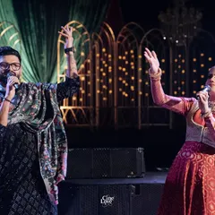 A candid moment on stage with the bride during a performance. It's these moments of shared joy and celebration that I love to be a part of.