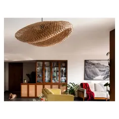 A favorite woven pendant light fixture, which adds texture and a soft glow to the living space. And of course, a furry friend enjoying the sun.