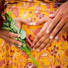 A close-up shot focusing on the hands forming a heart on the baby bump is a classic and symbolic maternity portrait. We use details like this to tell the story of your growing family.