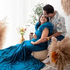 That sweet forehead kiss says it all. This couple chose a beautiful blue gown, and the earthy tones of the pampas grass and rustic decor make their connection the focus of the portrait.