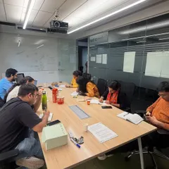 A typical scene from our workshop: writers deeply engaged in their notes during a session. These are not passive lectures; they are active, participatory experiences where everyone contributes.
