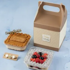 The Sibling's Gift Box comes with two of our popular dessert tubs and a rakhi, all packed in a convenient and festive box.
