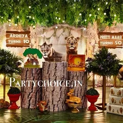 We created an enchanted forest with this 3D jungle theme decoration. The setup includes realistic, life-sized props of a deer and tiger, tree-stump pedestals for the cake, and a ceiling covered in hanging greenery and lights to make guests feel like they've stepped into a different world.