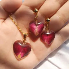 Your special flowers can be worn close to your heart. Here, I've preserved delicate rose petals in a matching heart-shaped pendant and earring set, making for a very personal and romantic piece of memorial jewelry.