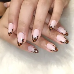 A classic French manicure, but make it fierce. I gave this timeless look a modern twist with hand-painted leopard print on the tips of these almond-shaped extensions.